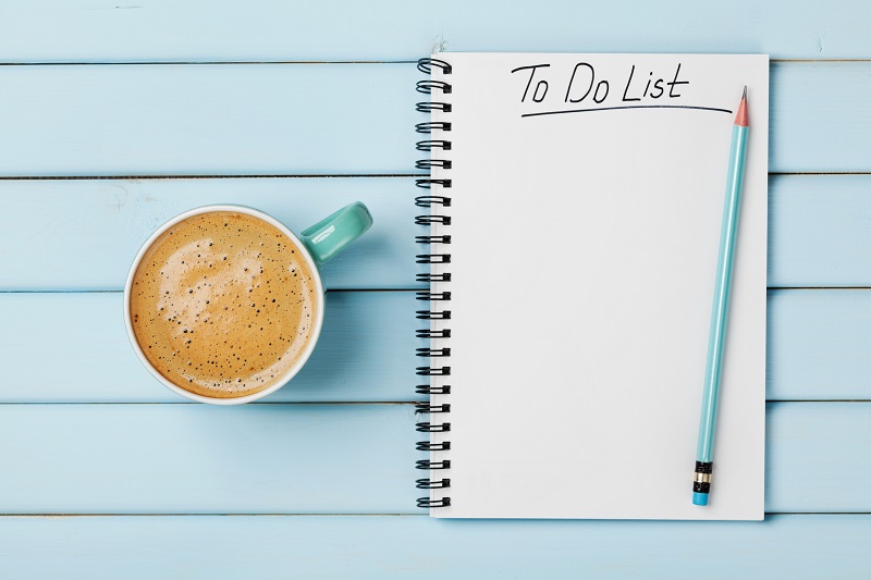 Coffee cup and notebook with to do list, planning concept Things You Should Do When Prioritizing Your Time
