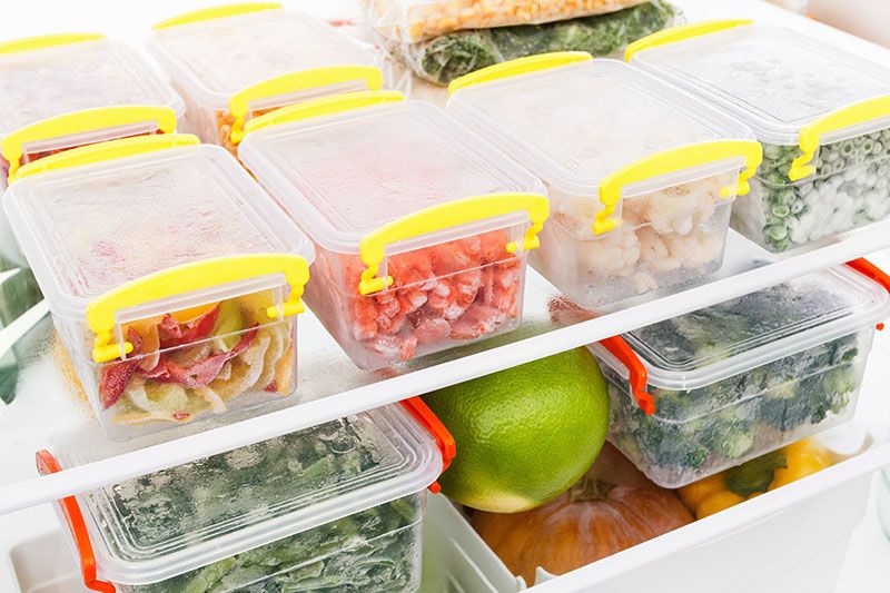 frozen food in the refrigerator vegetables on the freezer shelves