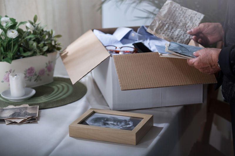 Tips to Ease The Stress Of Downsizing 5 memorabilia in a box