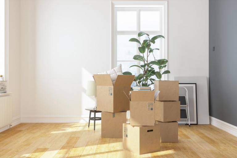 boxes piled in room for downsizing