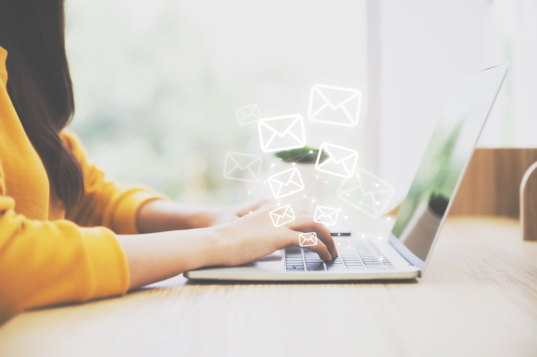 Woman hand using computer laptop pc with email icon. Concept of email and contact us Email Organization